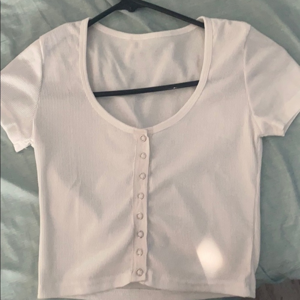 a white button up crop top